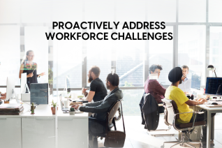 Office with diverse employees working and engaging in a discussion about proactively addressing workforce challenges through effective payroll management.