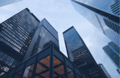  A meeting of executives from a Large Multinational Enterprise (MNE) collaborating on a global payroll strategy. They are discussing challenges and solutions for compliance, processing, and services to achieve a holistic global payroll ecosystem