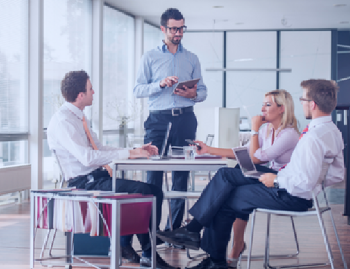 Mid-Sized Multinational Diverse team strategizes with global payroll solutions for multinational growth